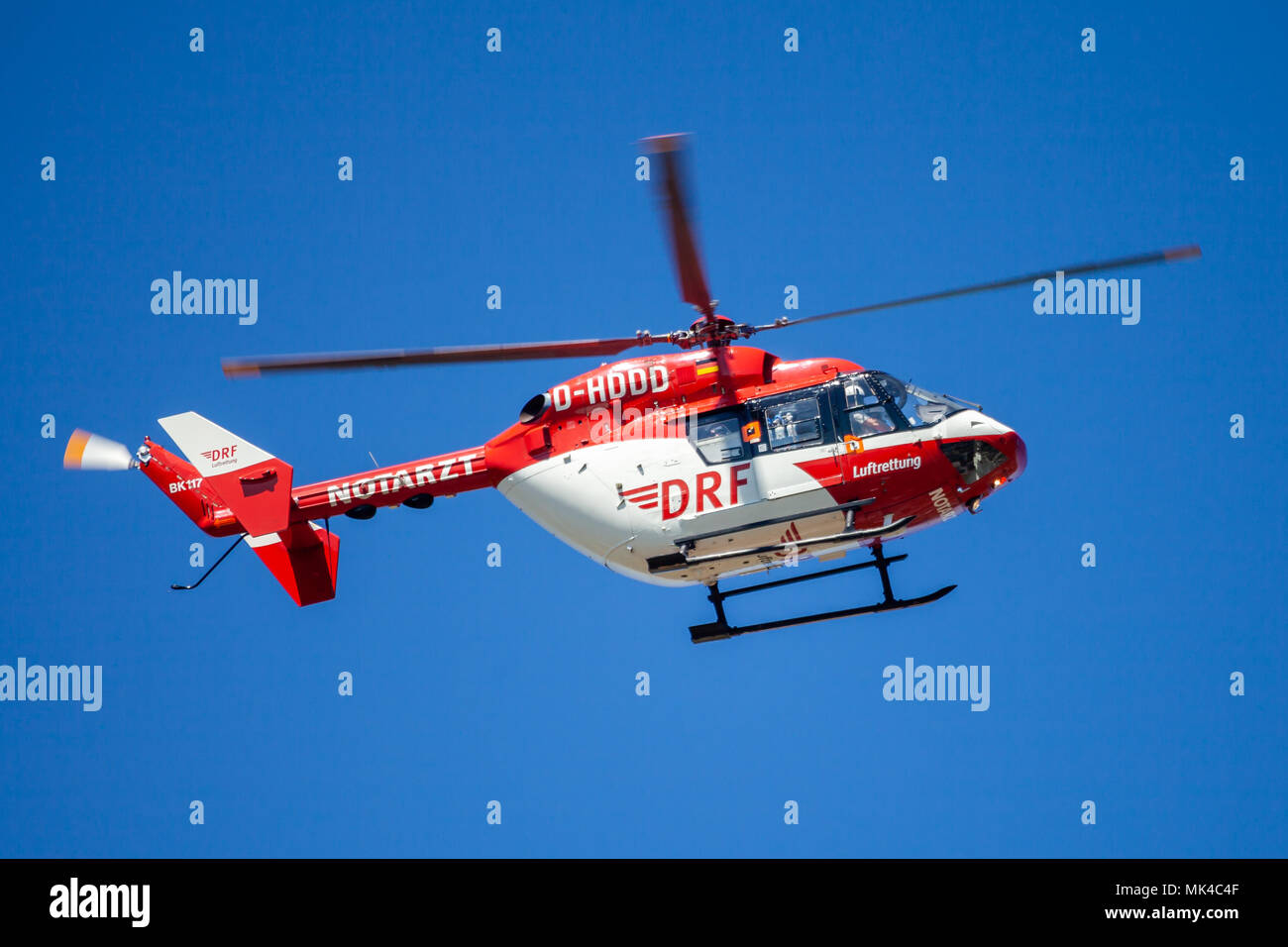 DELMENHORST / GERMANY - MAY 06, 2018: Eurocopter BK-117 from DRF Luftrettung flies over landing side. Notarzt means emergency doctor. Stock Photo