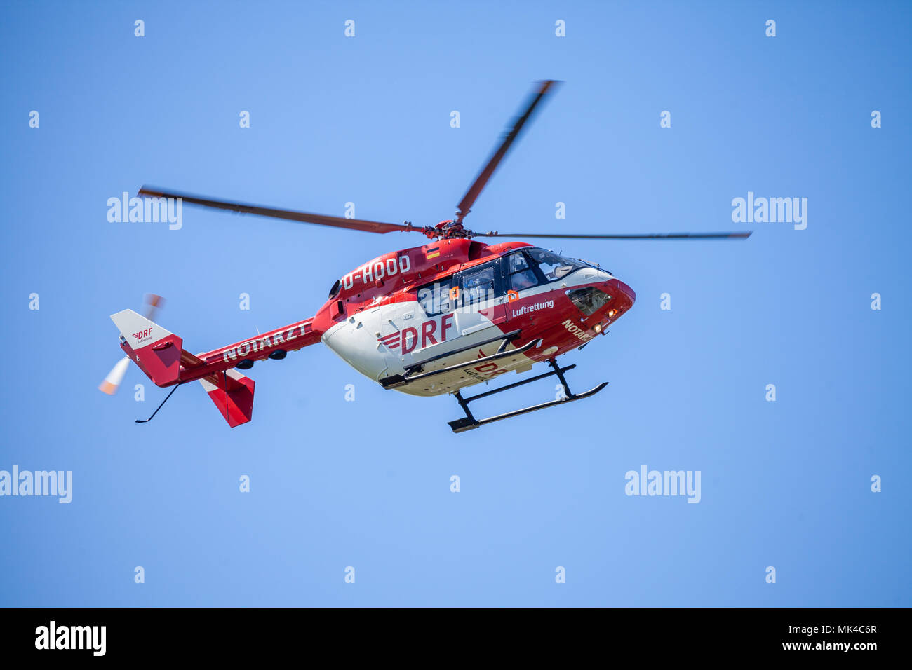 DELMENHORST / GERMANY - MAY 06, 2018: Eurocopter BK-117 from DRF Luftrettung flies over landing side. Notarzt means emergency doctor. Stock Photo