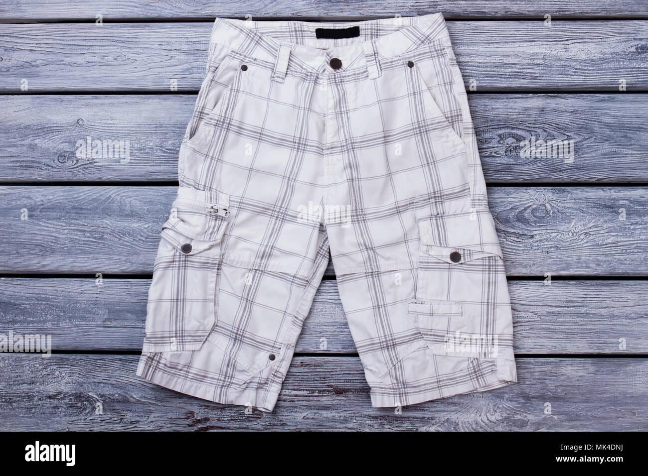 White checkered mens shorts on wood. Flat lay top view Stock Photo Alamy