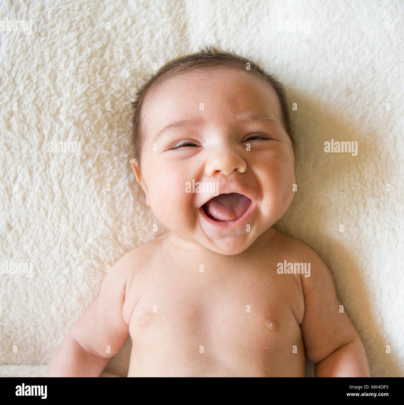 Laughing baby boy Stock Photo