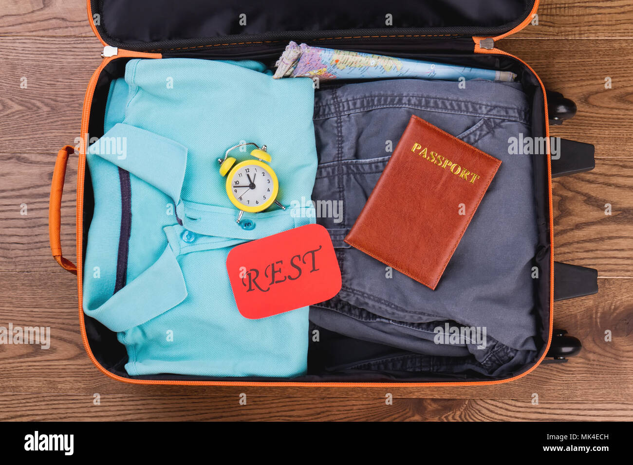 Packing luggage for vacation. Clothes and accessories flat lay, top view. Apparel for rest. Stock Photo