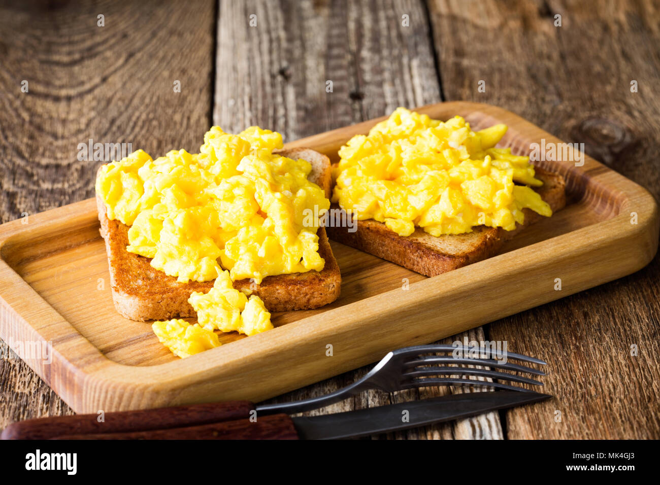 Scrambled Eggs On Two Pieces Of Toast On Wooden Table Healthy And Delicious Breakfast Stock Photo Alamy Scrambled Eggs On Two Pieces Of Toast On Wooden Table Healthy And Delicious Breakfast Stock Photo Alamy