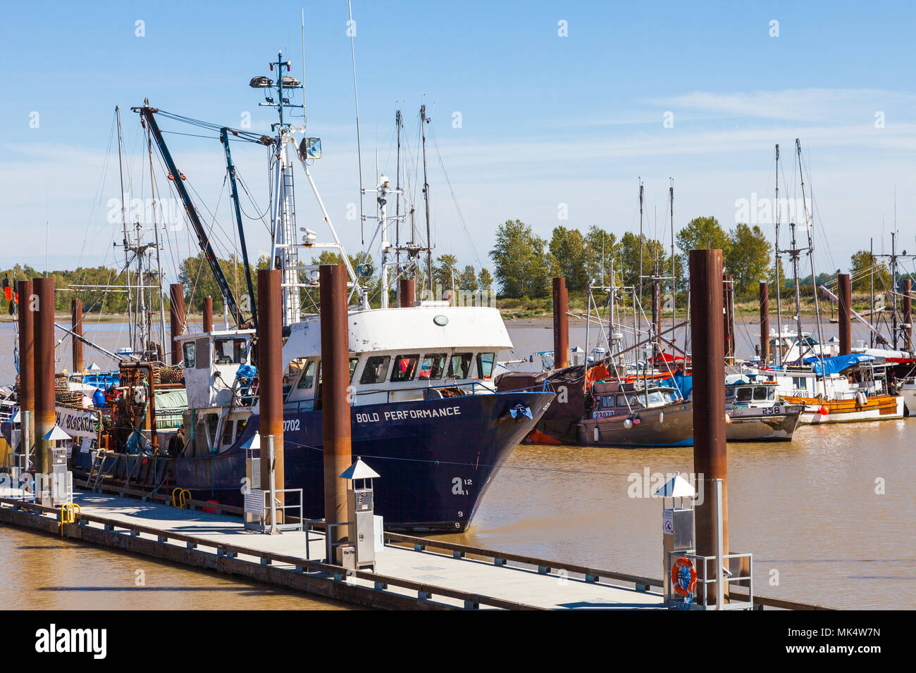 Commercial fishing boats tied up at the public fish market in Steveston, British Columbia, Canada Stock Photo