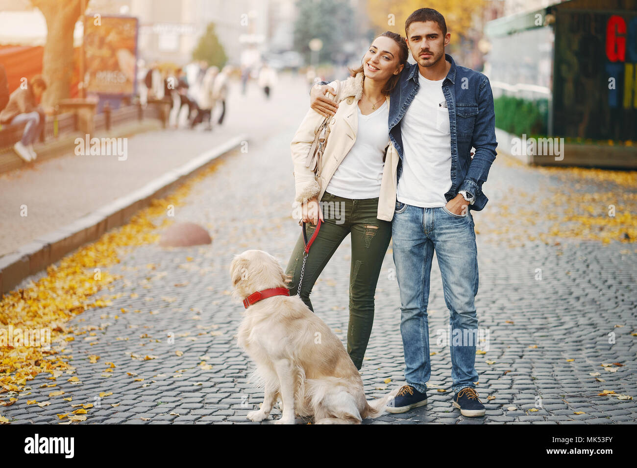 Young romantic couple walking dog hi-res stock photography and images ...