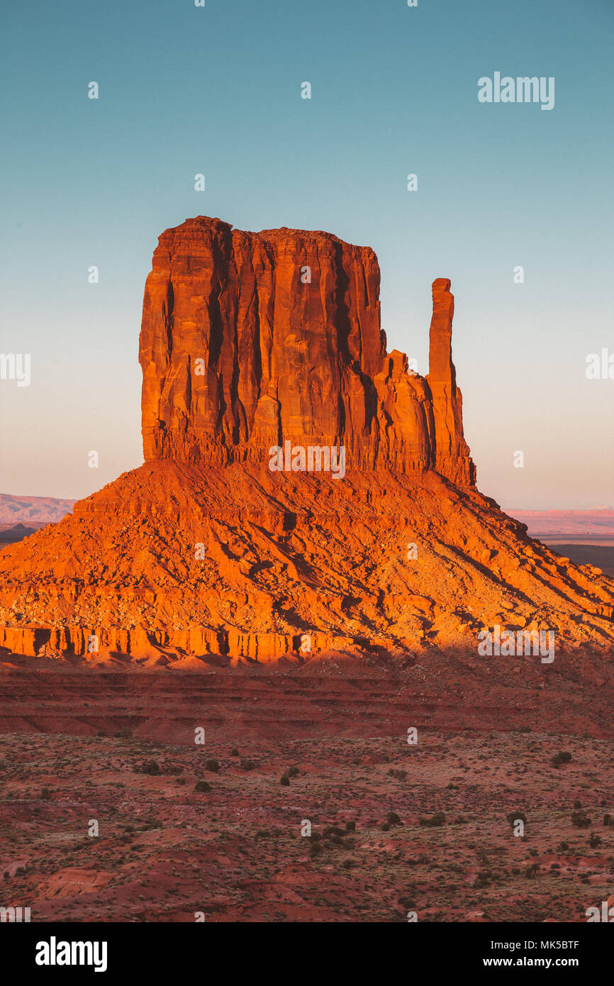 Classic view of famous West Mittens in Monument Valley illuminated in beautiful golden evening light at sunset in summer, Arizona, USA Stock Photo