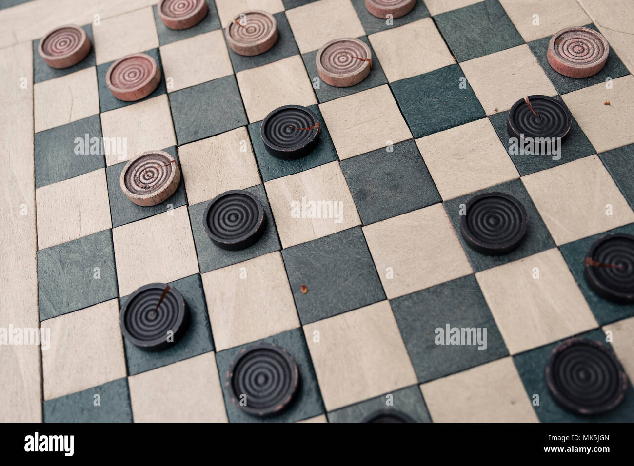 checkers game in public on sidewalk, step up and take a seat to play the  game with a friend or stranger Stock Photo - Alamy