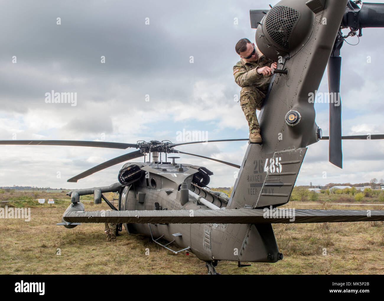 A Soldier from the 1-214th Aviation Regiment checks his aircraft during ...