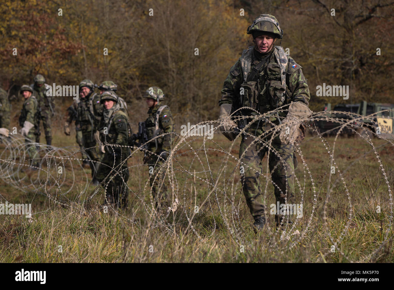 Czech Republic soldiers emplace obstacles during exercise Allied Spirit VII at the U.S. Army’s Joint Multinational Readiness Center in Hohenfels, Germany, Nov. 7, 2017. Approximately 4,050 service members from 13 nations are participating in exercise Allied Spirit VII at 7th Army Training Command’s Hohenfels Training Area, Germany, Oct. 30 to Nov. 22, 2017. Allied Spirit is a U.S. Army Europe-directed, 7ATC-conducted multinational exercise series designed to develop and enhance NATO and key partner’s interoperability and readiness. (U.S. Army photo by Spc. Jacquelynn Roberts) Stock Photo