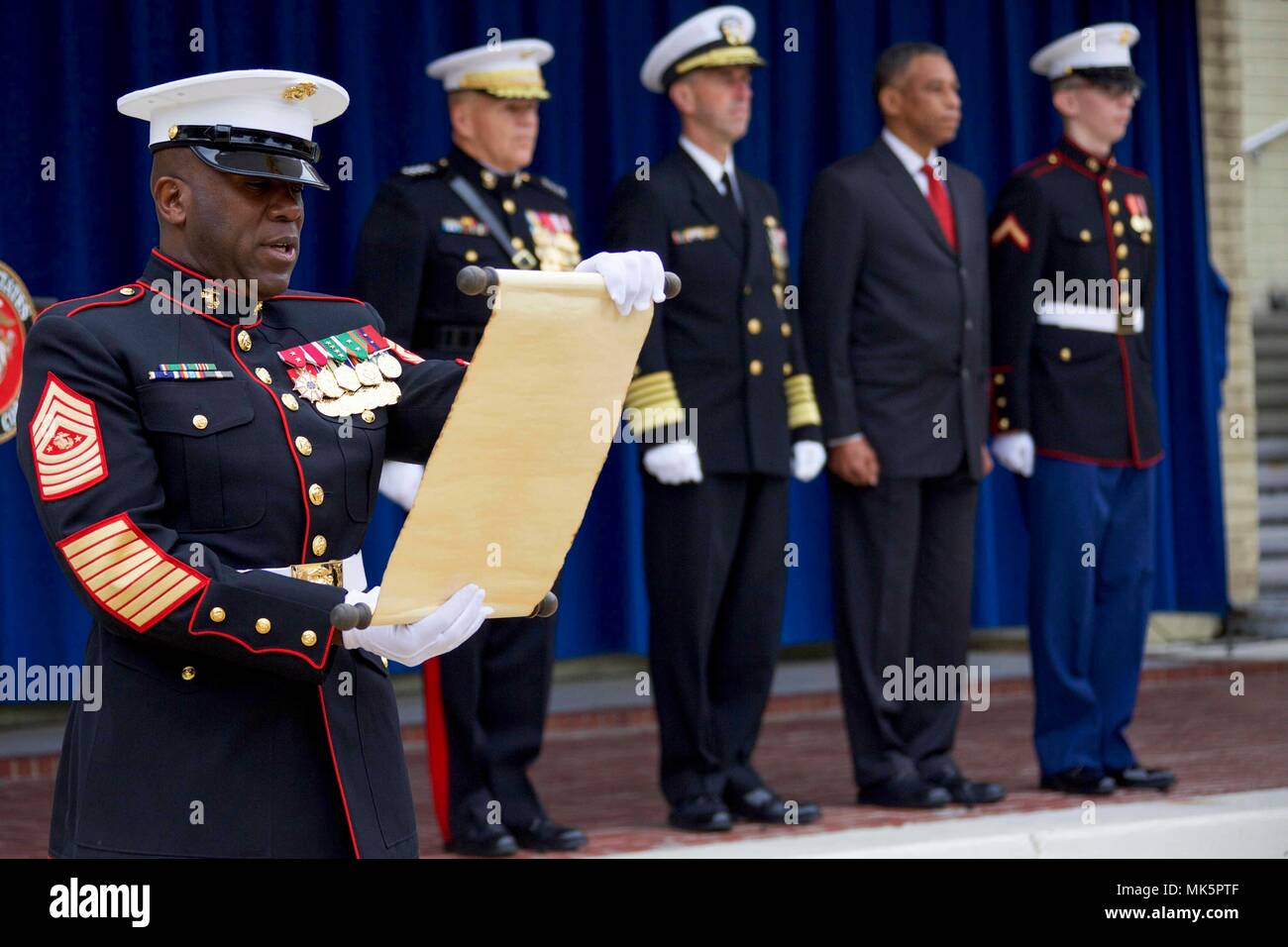 U.S. Marine Corps Sgt. Maj. Ronald L. Green, sergeant major of the Marine Corps, left, reads Gen