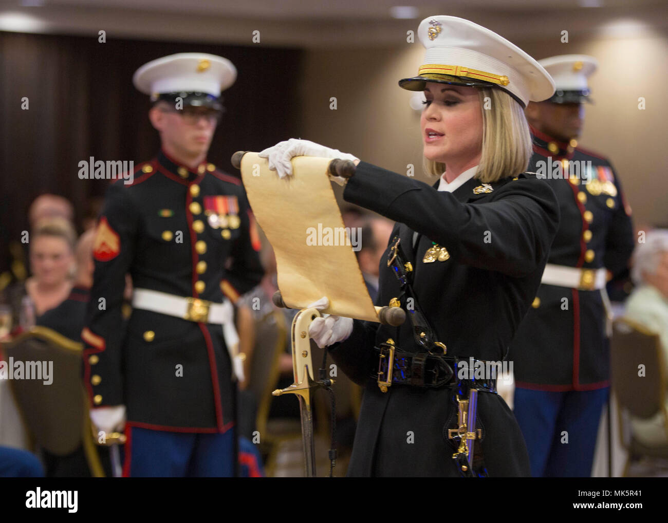 Captain Christina M. Shulman reads the birthday message from the 13th Commandant of the Marine Corps, Maj. Gen. John A. Lejeune, during 6th Marine Corps District’s (6MCD) 242nd Marine Corps Ball at the Omni Hotel Hilton Head, South Carolina, Nov 3, 2017. The Marines, Sailors and their families celebrated the Marine Corps Birthday Ball to increase morale and foster camaraderie throughout the District. The District Headquarters supports the efforts of recruiting within the Southeastern United States. Shulman is the adjutant for 6MCD. (U.S. Marine Corps photo by Lance Cpl. Jack A. E. Rigsby) Stock Photo