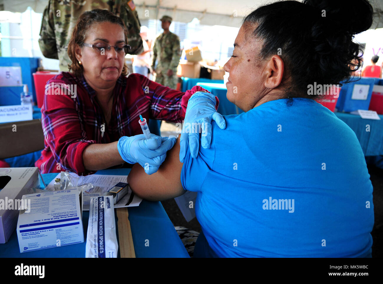 A representative with VOCES sterilizes a patient prior to administering