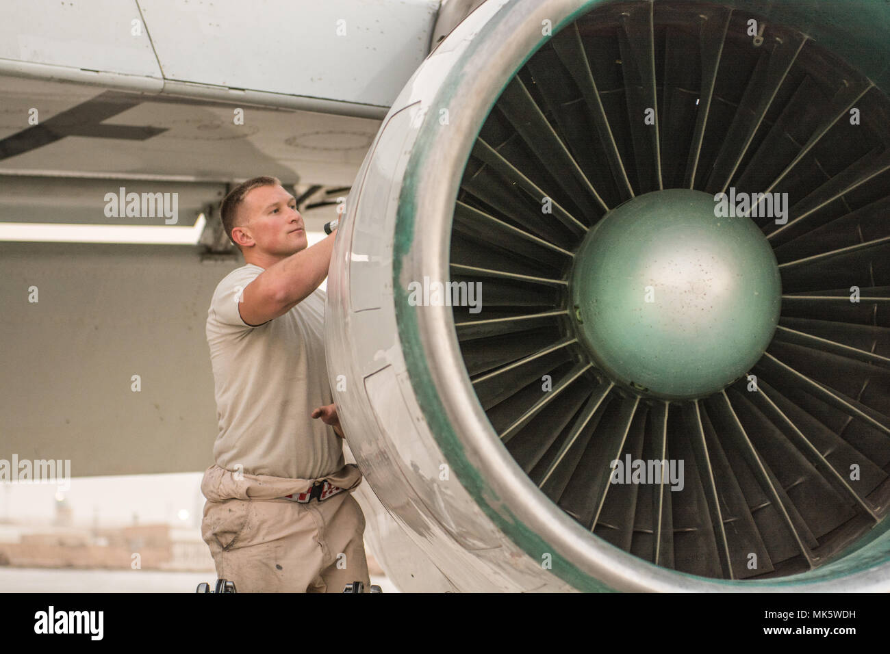 U.S. Air Force Staff Sgt. Daniel Spear, aerospace propulsion craftsman  assigned to the 7th Aircraft Maintenance Unit, performs post-flight  inspections of the intake and exhaust systems on an E-8C Joint Surveillance  Target