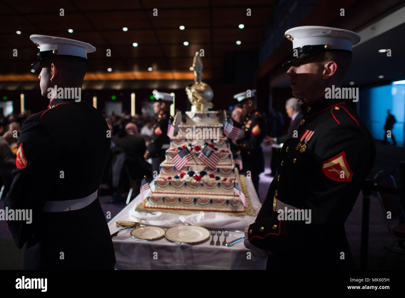 U.S. Marines escort the 242nd birthday cake during the Semper Fidelis