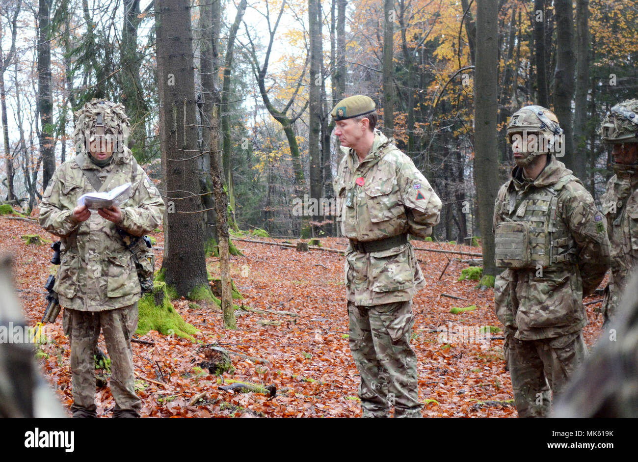 Despite the weather, British soldiers with the 1st Battalion, Royal Regiment of the Fusiliers take a moment for an impromptu Armistice Remembrance Ceremony during their training at the U.S. Army's Joint Multinational Readiness Center in Hohenfels, Germany, as they participate in Allied Spirit VII, 12 Nov. 2017. Approximately 4,050 service members from 13 nations are participating in exercise Allied Spirit VII at 7th Army Training Command’s Hohenfels Training Area, Germany, Oct. 30 to Nov. 22, 2017. Allied Spirit is a U.S. Army Europe-directed, 7ATC-conducted multinational exercise series desig Stock Photo