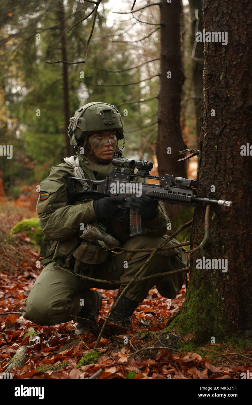 Lithuanian army Pfc. Ausha Ambrulaityte of the Lithuanian Griffin Brigade provides security while conducting battle circulations during exercise Allied Spirit VII at the U.S. Army’s Joint Multinational Readiness Center in Hohenfels, Germany, Nov. 13, 2017. Approximately 4,050 service members from 13 nations are participating in exercise Allied Spirit VII at 7th Army Training Command’s Hohenfels Training Area, Germany, Oct. 30 to Nov. 22, 2017. Allied Spirit is a U.S. Army Europe-directed, 7ATC-conducted multinational exercise series designed to develop and enhance NATO and key partner’s intero Stock Photo