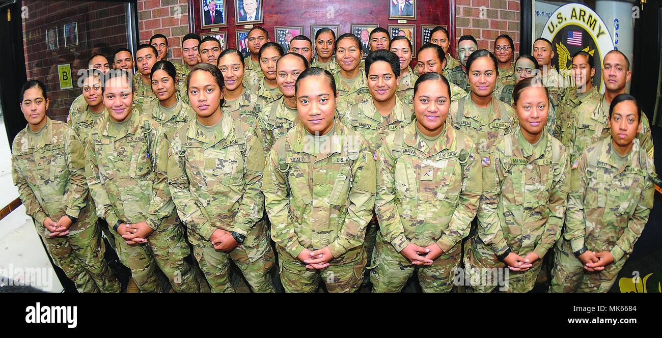 More than 30 members of an American Samoa family pose for pictures Nov. 8 at Thompson Hall.  The Soldiers are advanced individual training students and most are enrolled in the Unit Supply Specialist Course taught by the Quartermaster School.  In all,, there are 41 members of the same Samoan family training at Fort Lee. Stock Photo