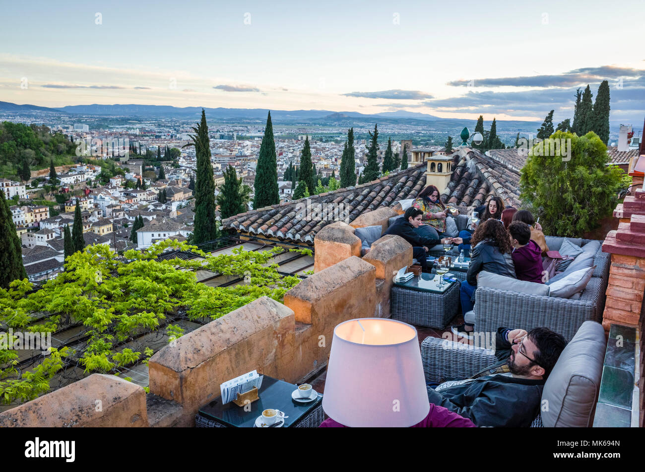 Granada, Andalusia, Spain - April 29th, 2018 : Tourists at Huerto de Juan Ranas cafe and restaurant in the Unesco listed Albaicin district old town, e Stock Photo
