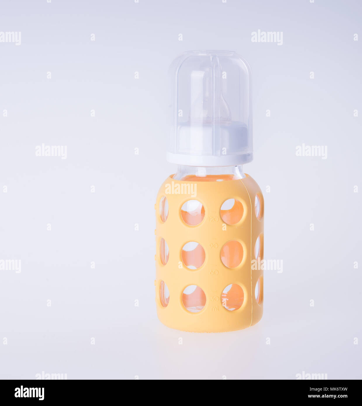 baby glass bottle or yellow baby bottles or background Stock Photo - Alamy