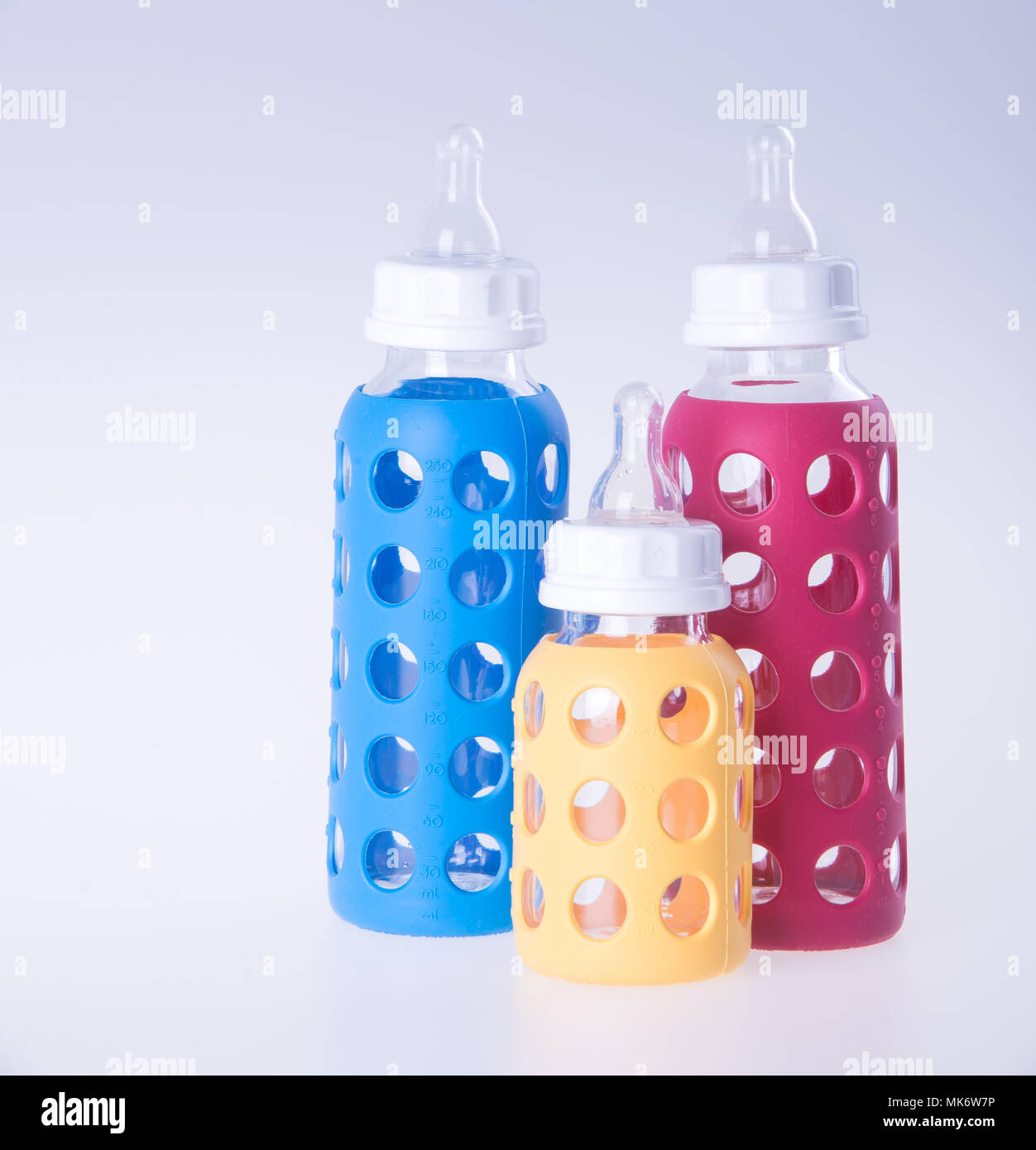 baby glass bottle or three baby bottles on background Stock Photo Alamy