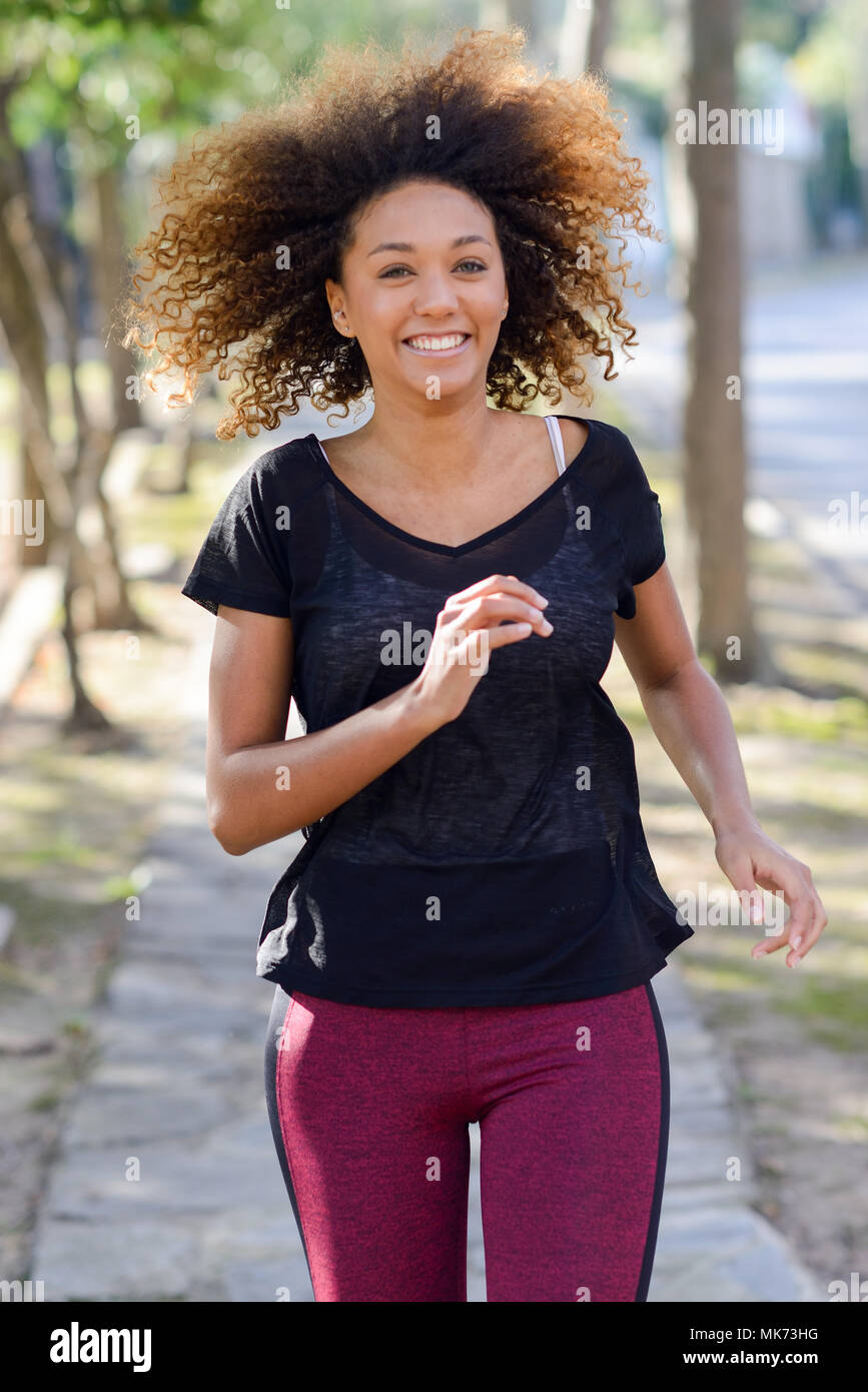 Running woman. Black Female Runner Jogging during Outdoor Workout in a  Park. Beautiful fit Girl. Fitness model outdoors. Weight Loss Stock Photo -  Alamy