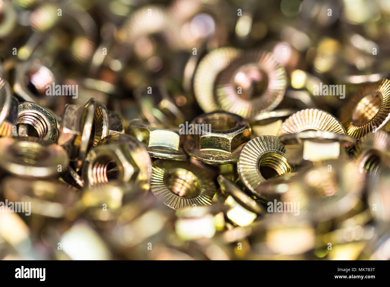 Many bronze hex nuts close Stock Photo Alamy