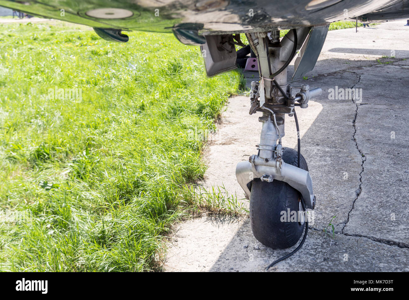 Close-up view of front air plane landing gear. Aircraft tyre wear and replacement.Maintenace and service. Stock Photo