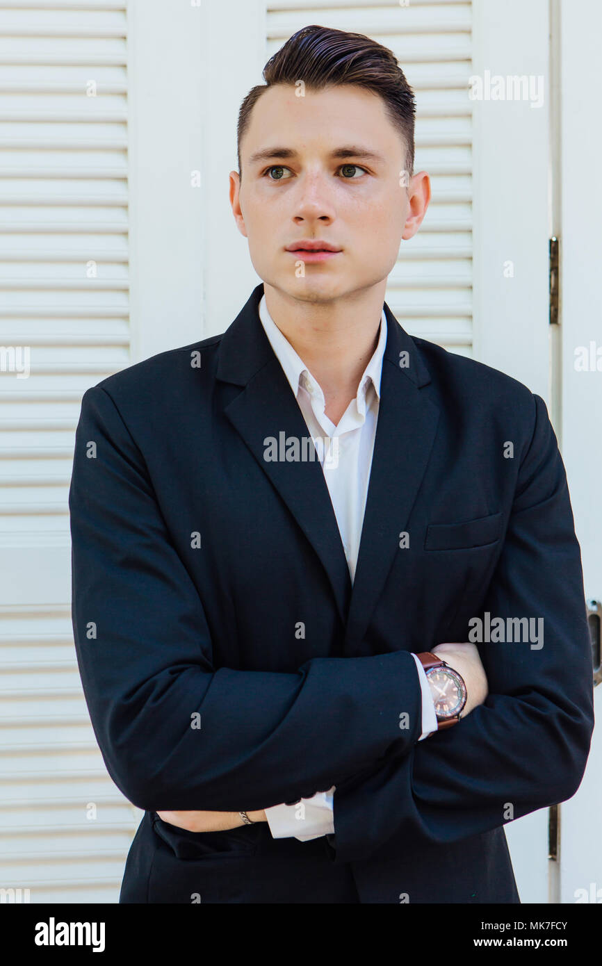 Portrait of handsome man in black suit Stock Photo - Alamy