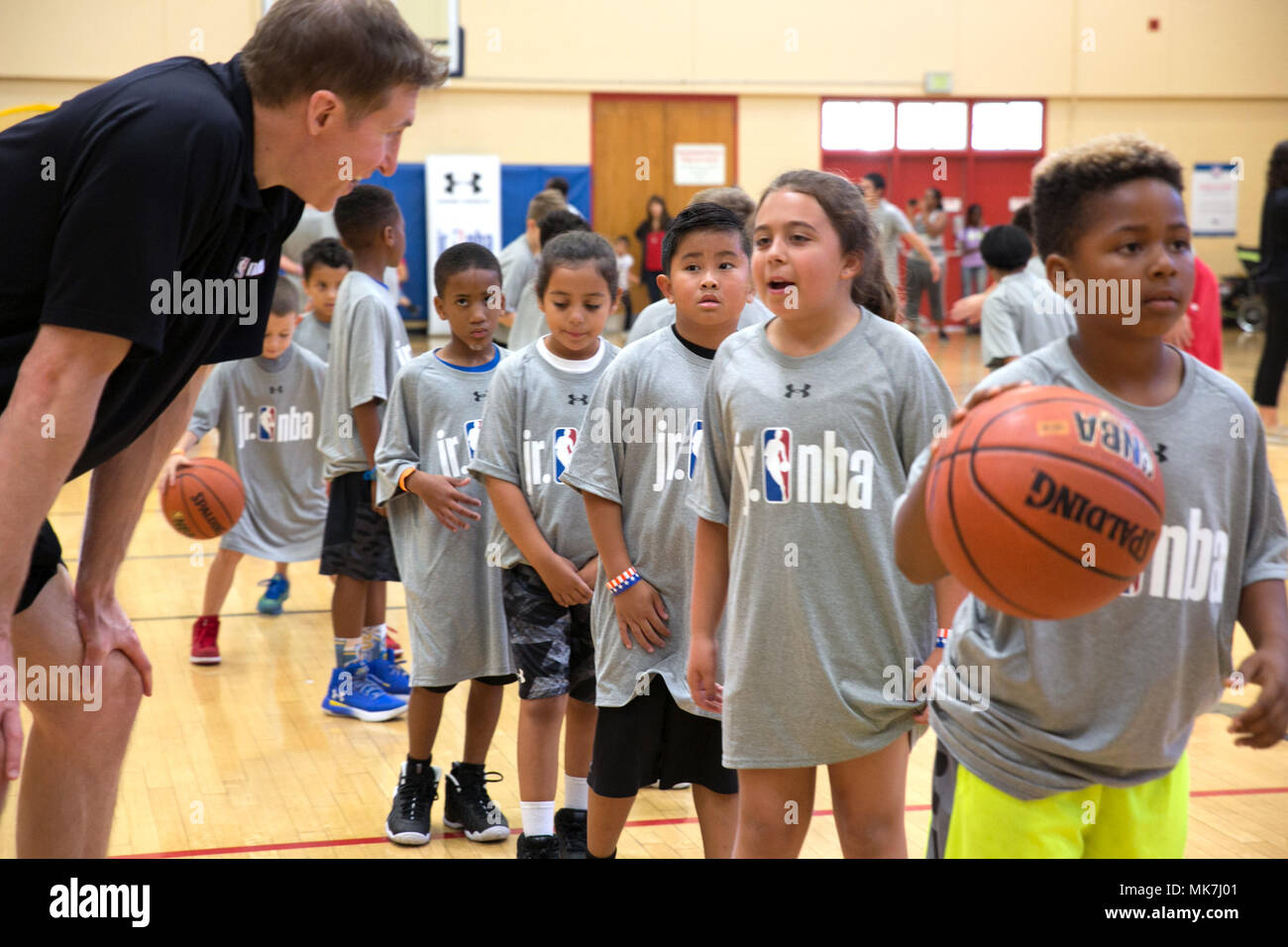171111-N-RP435-054 SAN DIEGO (Nov. 11, 2017) Professional basketball player  Troy Murphy interacts with a participant during the youth camp portion of  the Junior National Basketball Association (Jr. NBA) Navy Tip-Off  Celebration. Naval