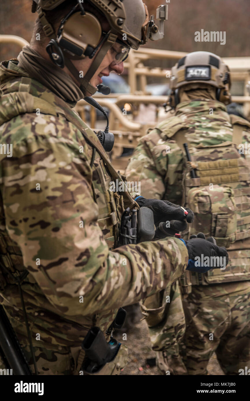 A Green Beret assigned to 1st Battalion, 10th Special Forces Group  (Airborne), loads a magazine before a Special Forces Advanced Urban Combat  (SFAUC) training exercise near Stuttgart, Germany, Nov. 16, 2017. The