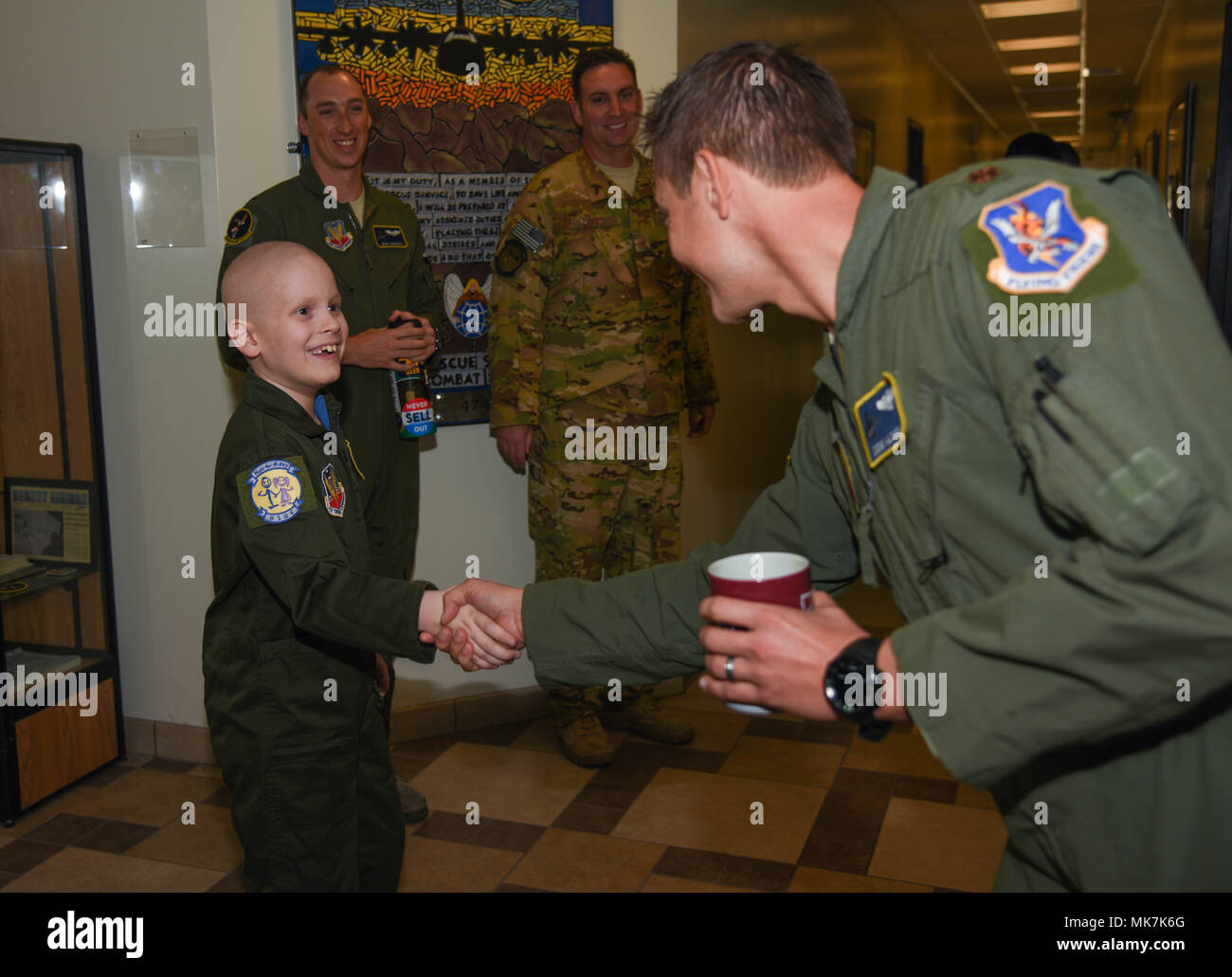 George Mitchell, Davis-Monthan Air Force Base’s Pilot for a Day, meets his fellow pilots after being sworn in as a pilot in the U.S. Air Force at D-M AFB, Ariz., Nov. 6, 2017. Davis-Monthan’s Pilot for a Day program invites children with serious or chronic health conditions to be a guest of one of D-M’s flying squadrons for a day. (U.S. Air Force photo by Airman 1st Class Frankie D. Moore) Stock Photo