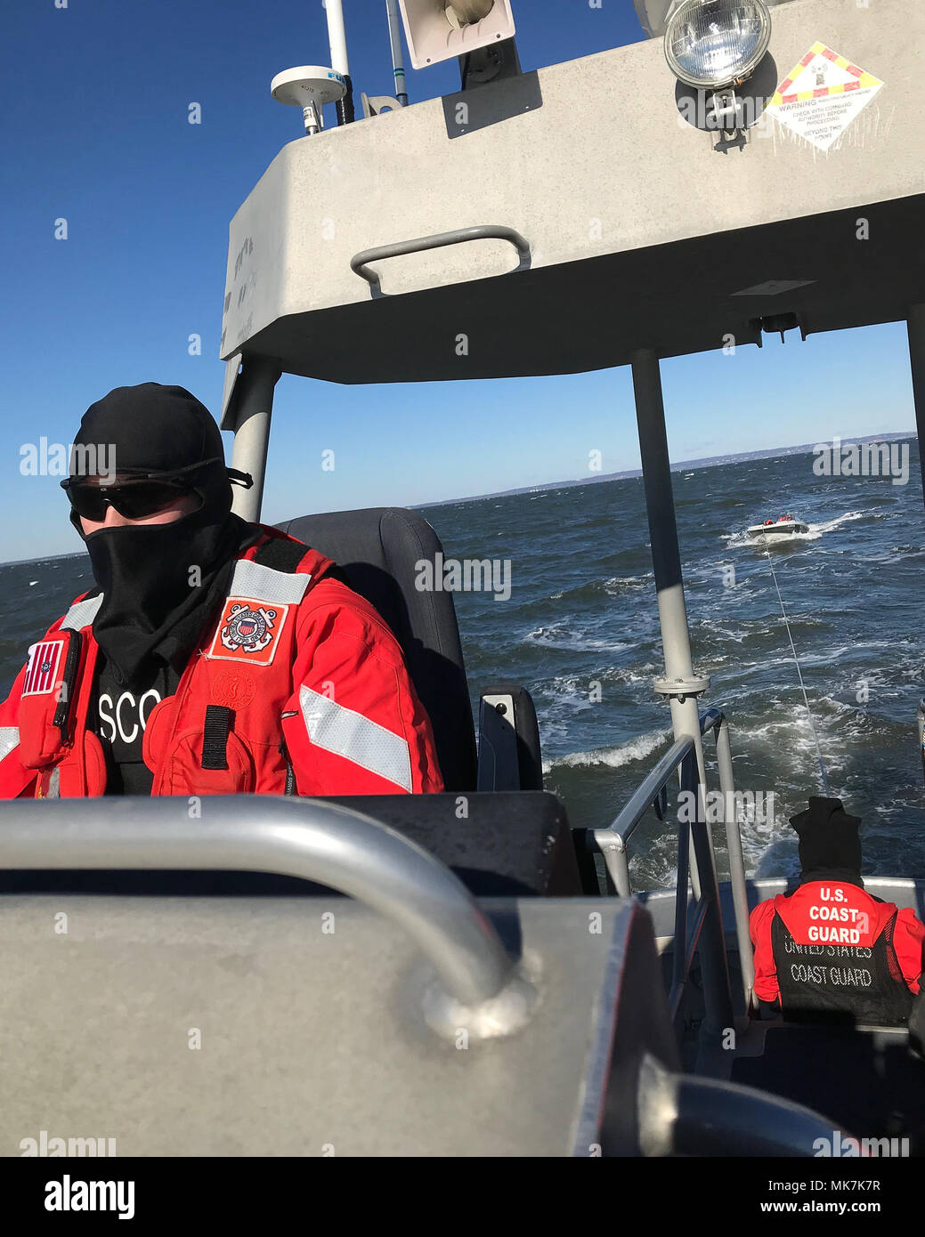 A Coast Guard Station Sandy Hook boatcrew assists three boaters who