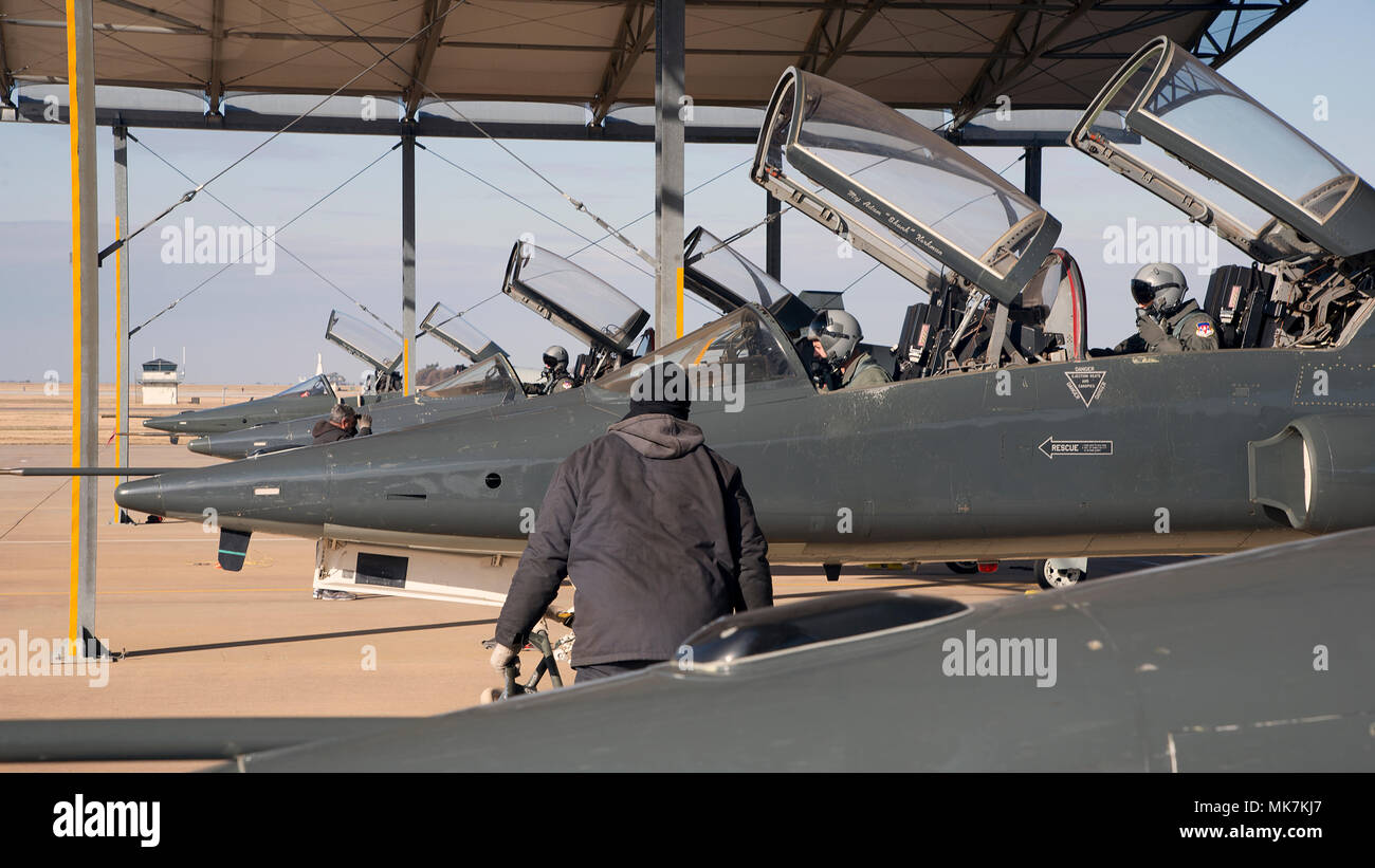 Vance pilots go through pre-flight checks in T-38C Talon as they prepare to taxi onto the flightline Nov. 8, 2017, at Vance Air Force Base, Oklahoma. Student pilots use the T-38 in aerobatics, formation, night, instrument and cross-country navigation training. (U.S. Air Force photo by Airman 1st Class Taylor Crul) Stock Photo
