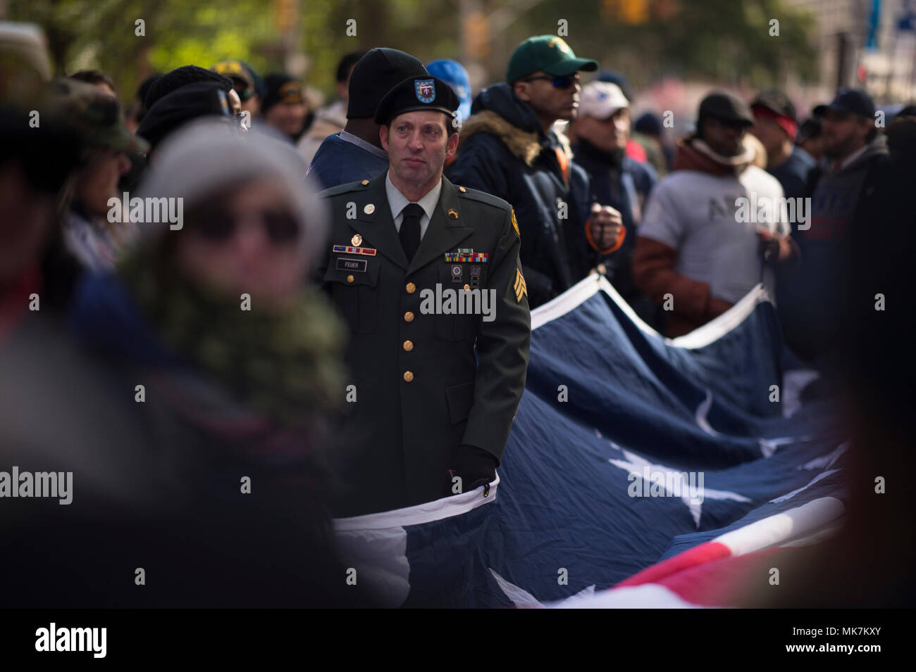 Volunteers with the New York City Veteran's Alliance hold the ...