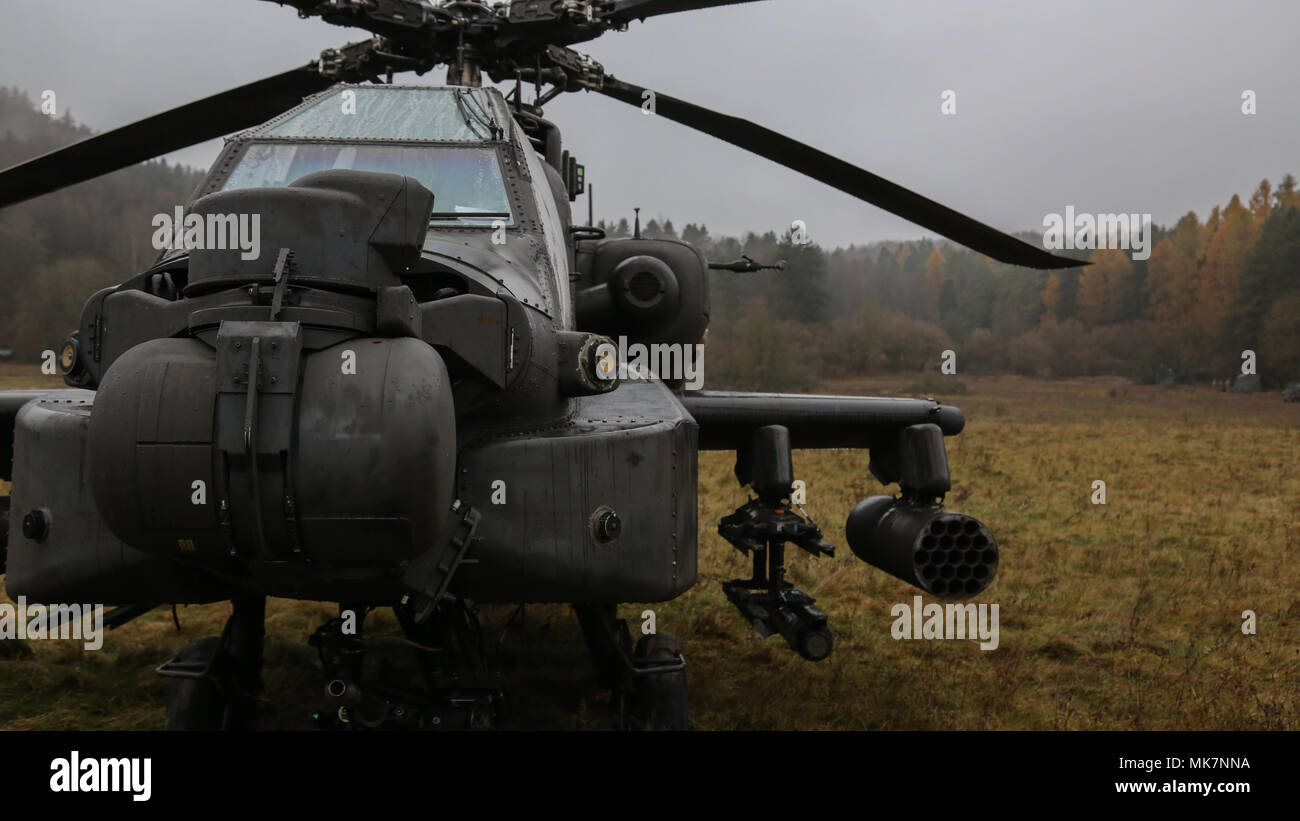 An AH-64D Apache Longbow helicopter is staged during exercise Allied Spirit VII at the U.S. Army’s Joint Multinational Readiness Center in Hohenfels, Germany, Nov. 17, 2017. Approximately 4,050 service members from 13 nations are participating in exercise Allied Spirit VII at 7th Army Training Command’s Hohenfels Training Area, Germany, Oct. 30 to Nov. 22, 2017. Allied Spirit is a U.S. Army Europe-directed, 7ATC-conducted multinational exercise series designed to develop and enhance NATO and key partner’s interoperability and readiness. (U.S. Army photo by Pfc. Meagan Mooney) Stock Photo