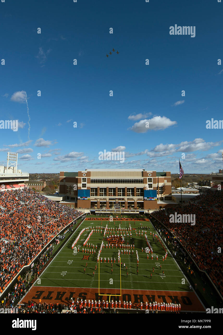 Vance pilots in the T-38C Talon fly over Boone Pickens Stadium in Stillwater, Oklahoma, Nov. 18. The flyover was for the football game between Oklahoma State University and Kansas State University, Manhattan, Kansas. (U.S. Air Force photo by Airman 1st Class Taylor Crul) Stock Photo