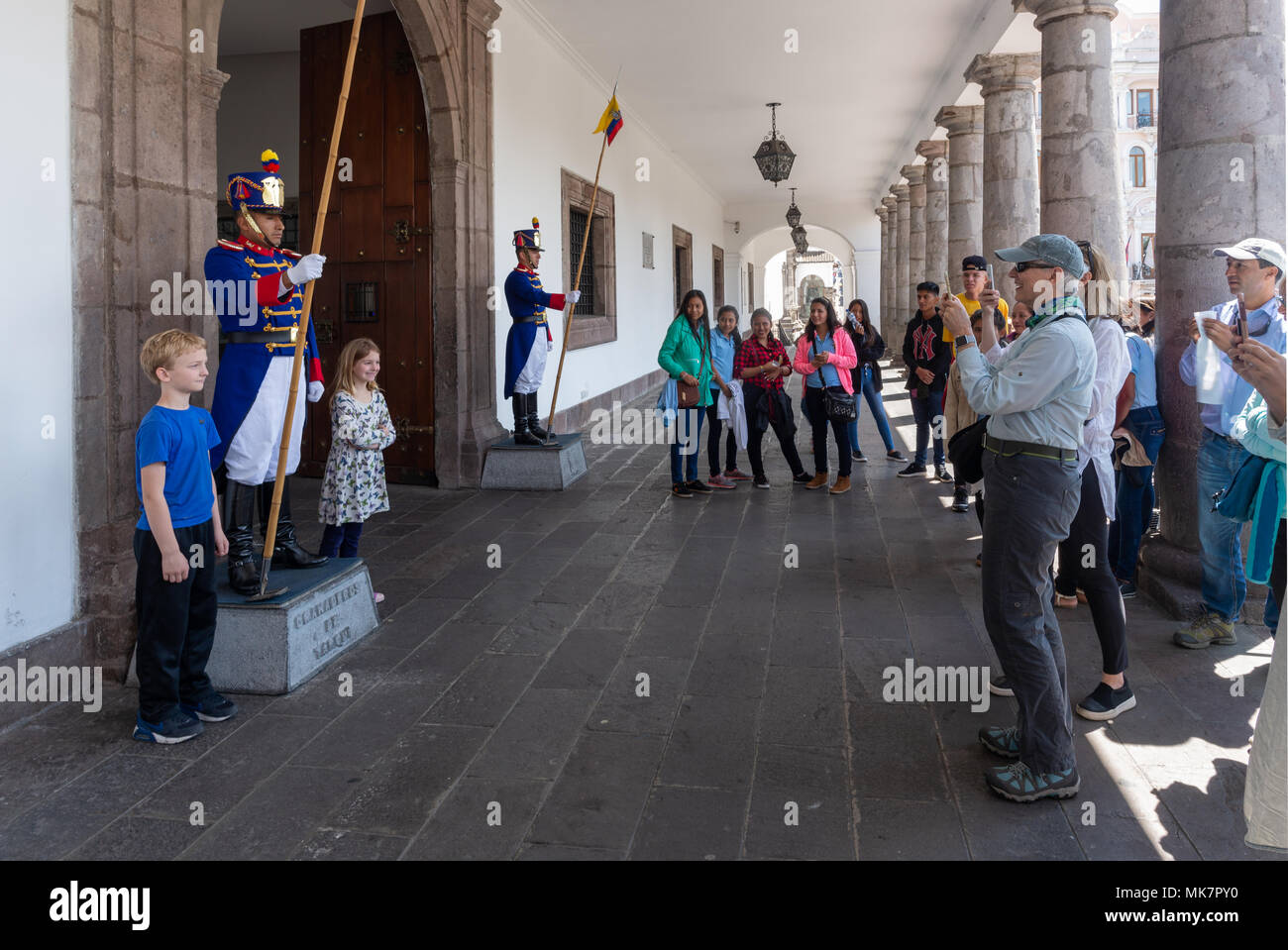 Tour group and the Presidential guard at the Carondelet Palace in the historic old city of Quito, Ecuador. Stock Photo