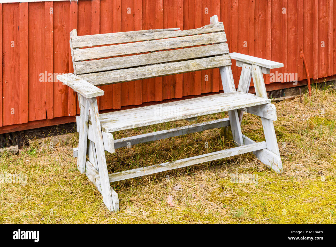 Ahus, Sweden. Outdoor bench outside a red cabin. Stock Photo