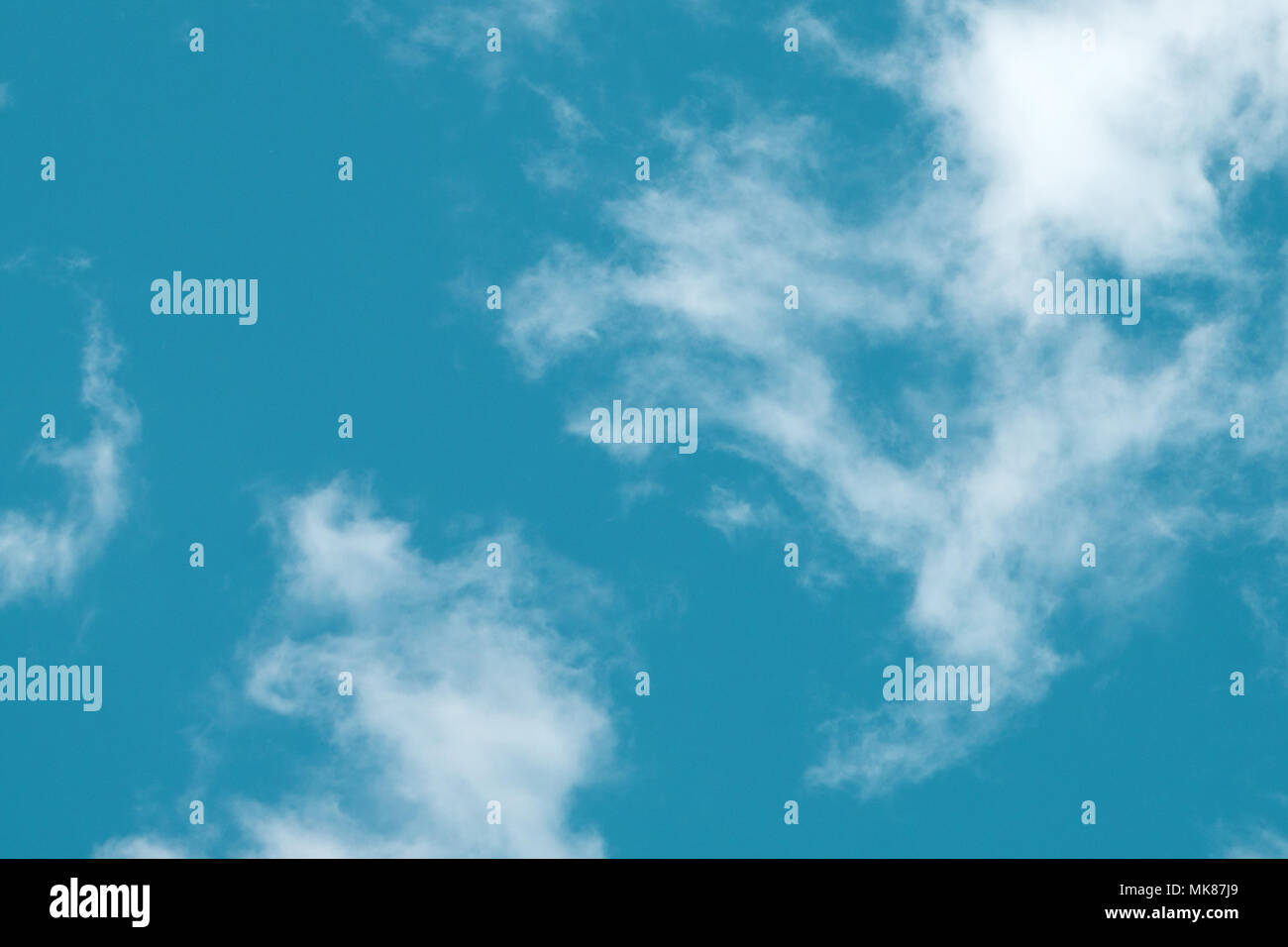 small clouds in the blue sky. Evening sky with lots small clouds - natural background Stock Photo