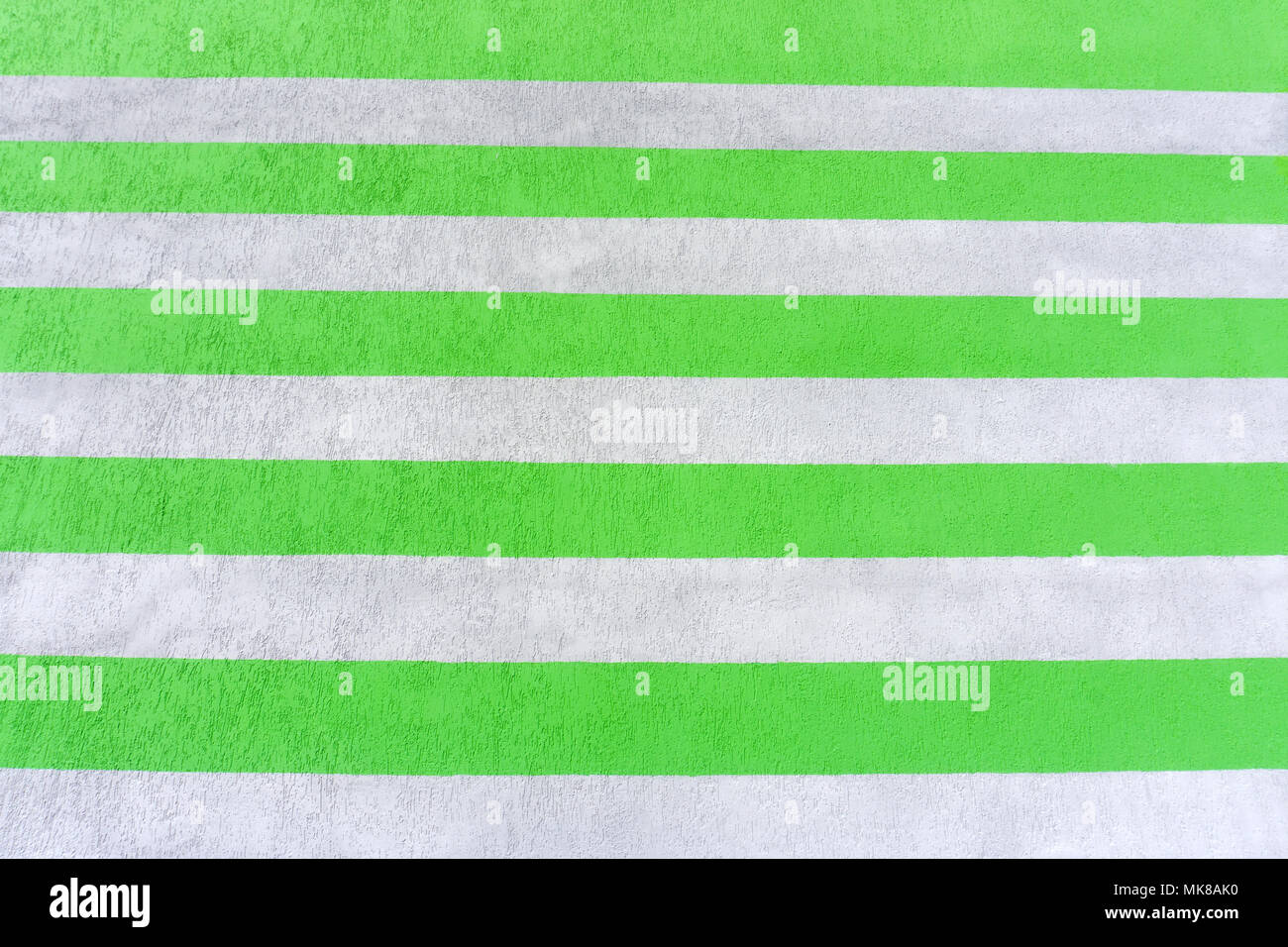 Abstract parallel stripes of beige and white on the plastered wall. Background Stock Photo