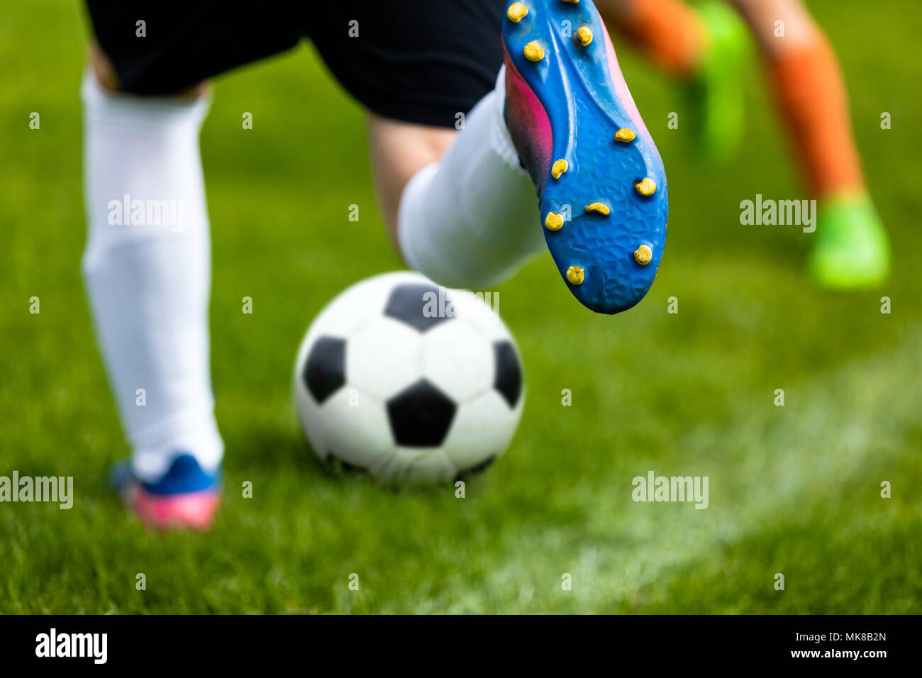 Soccer boots on grass hires stock photography and images Alamy
