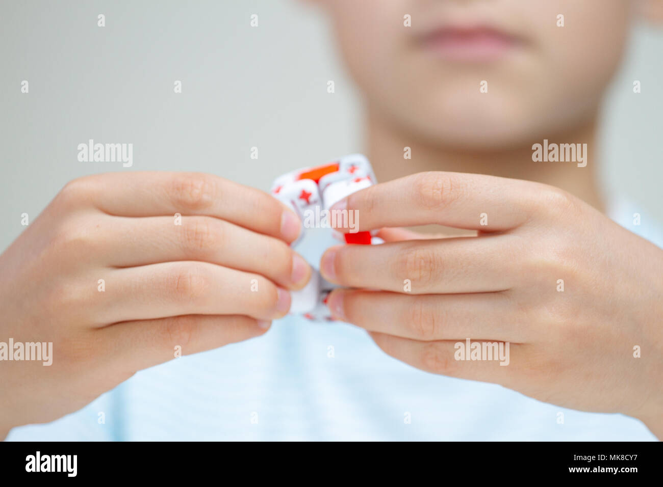 Colorful fingers antistress fidget cube toy in hand on white background.  development of fine motor skills of fingers of children 10336547 Stock  Photo at Vecteezy