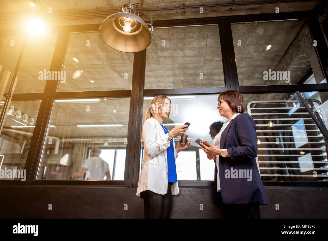 Bakery office with business women talking together Stock Photo