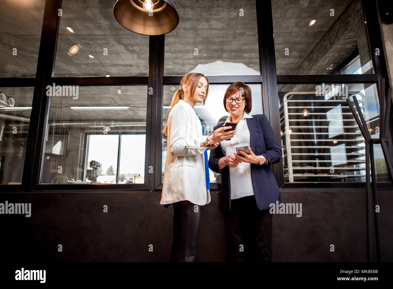 Bakery office with business women talking together Stock Photo