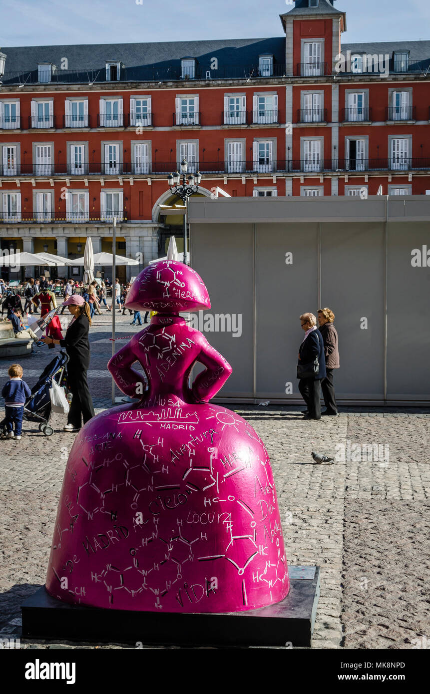 An art figure Menina back view  in the old town, Mayor square, Madrid city, Spain. Stock Photo