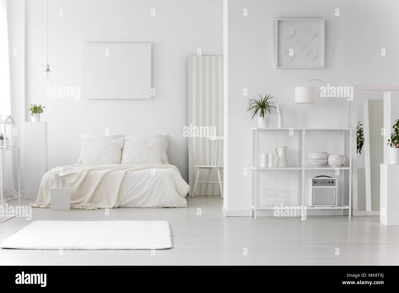 Rug In Minimal White Bedroom Interior With Empty Poster Above Bed Next To Chair Stock Photo Alamy