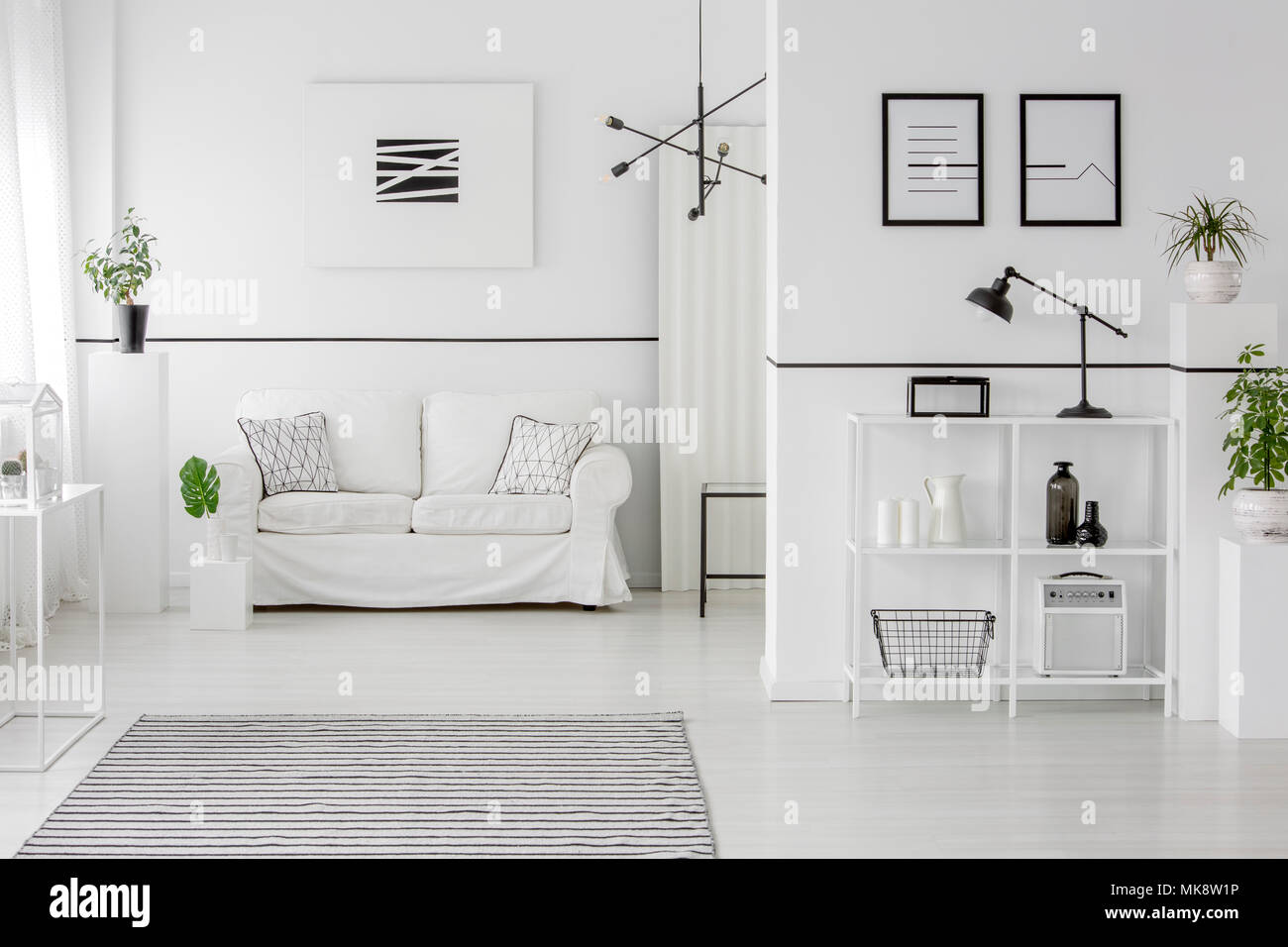 Striped carpet in spacious white living room interior with minimal