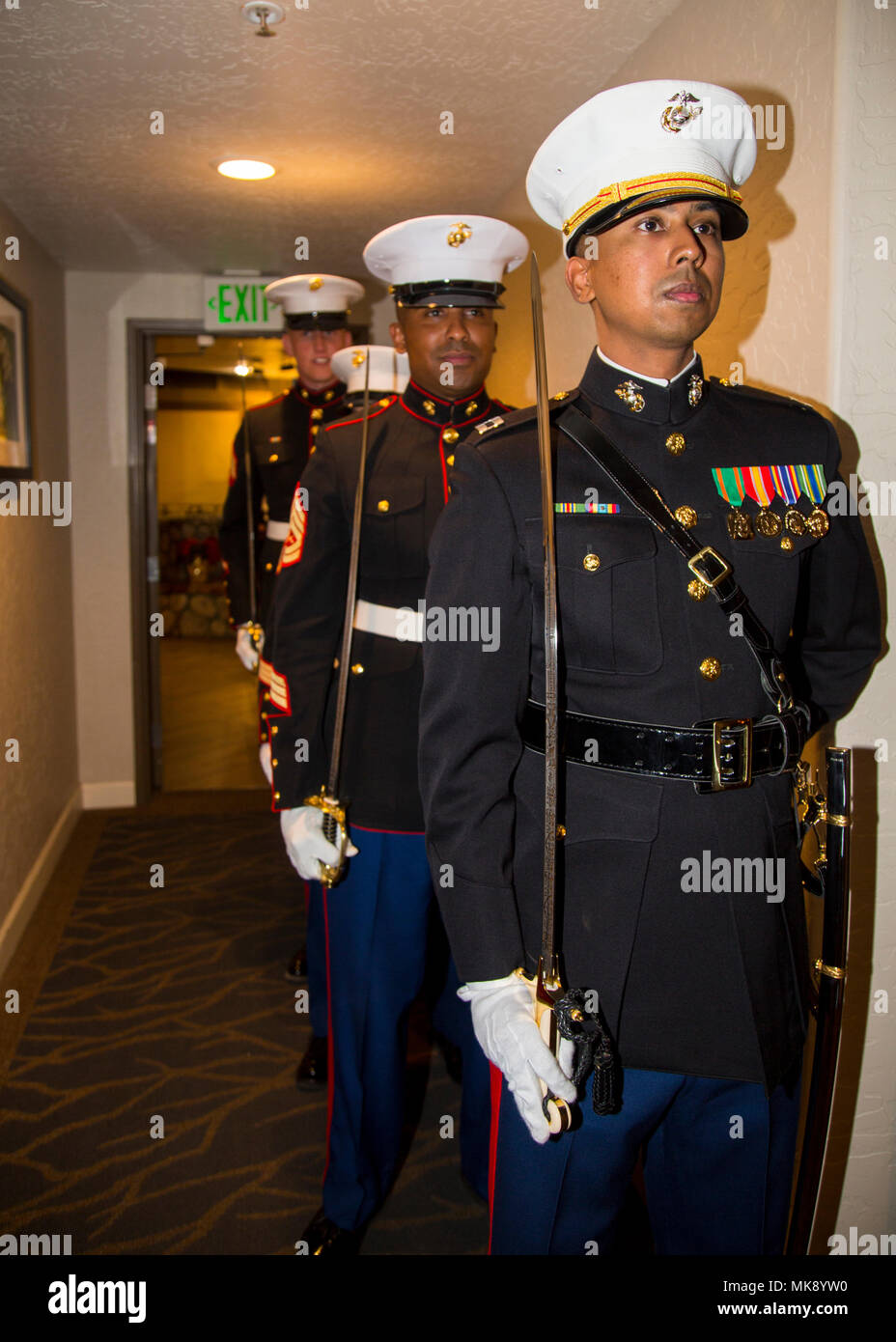 dress blues usmc nco sword Marine Corps Sword Detail is a ceremonial unit responsible for formal drill and sword movements during official events. The archival image documents preparation activities for a Marine Corps Birthday Ball ceremony held