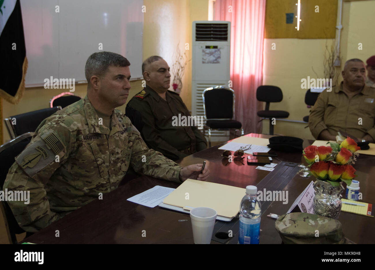 CAMP TAJI, Iraq (Nov. 7, 2017) – Brig. Gen. Christopher Sharpsten, CJ4 with the Combined Joint Task Force and Staff Maj. Gen. Hassan Hillel Al-Maliki, director of Iraqi maintenance with the Iraqi forces, leads the logistics symposium. Iraqi and U.S. forces met and discussed upcoming operations by sharing intelligence, developing security strategies and targeting plans. The symposium promotes interoperability between the countries. (U.S. Army image edited by Sgt. Jaccob Hearn) Stock Photo