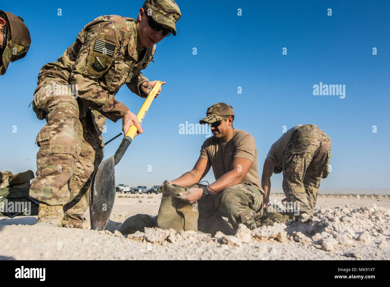 https://c8.alamy.com/comp/MK91XT/us-air-force-senior-airman-luke-bryant-and-staff-sgt-oscar-morales-both-explosive-ordnance-disposal-technicians-assigned-to-the-379th-expeditionary-civil-engineer-squadron-fill-sand-bags-during-a-joint-chemical-threat-training-exercise-at-al-udeid-air-base-qatar-nov-25-2017-the-379th-eod-flight-379th-bioenvironmental-engineering-flight-and-379th-readiness-and-emergency-management-flight-responded-to-a-simulated-chemical-agent-threat-the-sandbags-were-used-to-secure-munitions-while-they-were-being-assessed-by-eod-technicians-us-air-national-guard-photo-by-staff-sgt-patrick-even-MK91XT.jpg