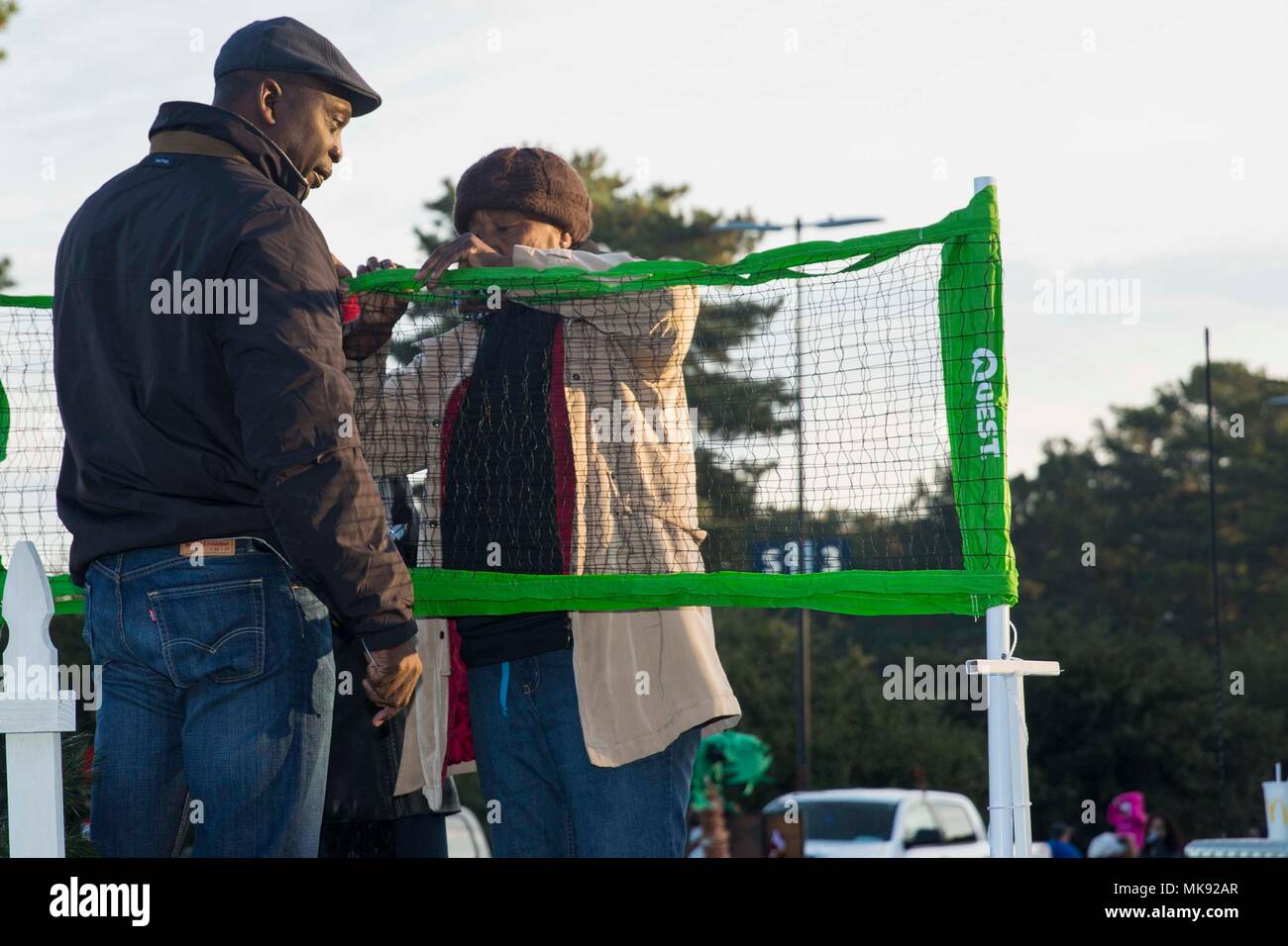 William C. Jones, left, pastor, and Claudie Anthony, right, church member of Marshall Chaperd Missionary Baptist Church prepare their float before the holiday parade in Jacksonville, N.C., Nov. 18, 2017. The 62nd Annual Jacksonville-Onslow Christmas Holiday Parade moved down Western Boulevard with 200 floats, patrons, and U.S. Marine leaders participating in the parade which began at Coastal Carolina Community College and ended at Brynn Marr Shopping Center. (U.S. Marine Corps photo by Pfc. Isaiah Gomez) Stock Photo